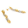 Orecchini a catena fantasia in oro 18kt bicolore 315,00 € Orecchini Donna