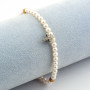 Bracciale di perle con croce in oro 18kt 169,00 € Bracciali con gemme