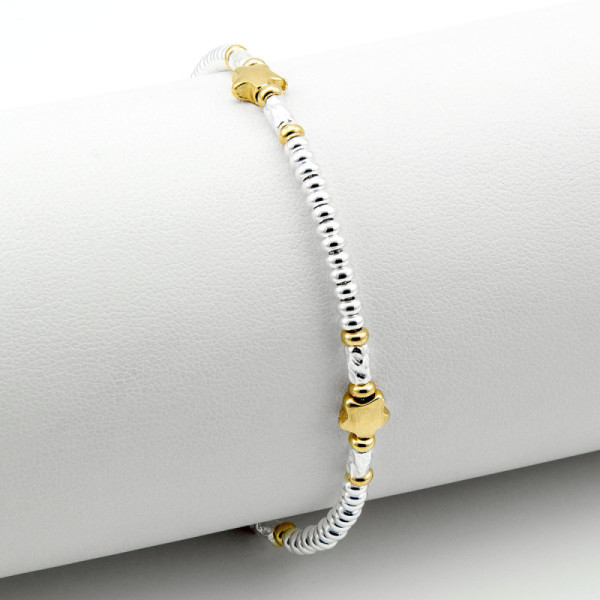 Bracciale in argento a rondelle con fiori dorati 45,00 € Bracciali Donna