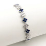 Zoppi Jewels:Bracciale tennis con fiori in acciaio e zirconi bianchi e blu:23,00 €