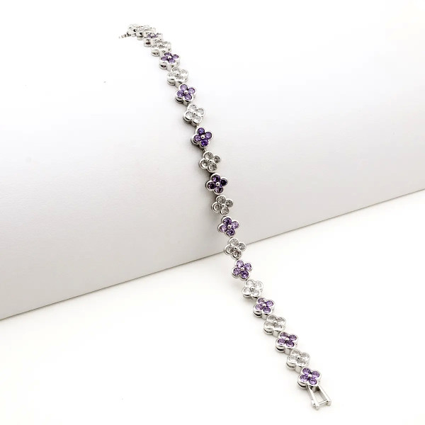 Zoppi Jewels:Bracciale tennis con fiori in acciaio e zirconi bianchi e viola:23,00 €