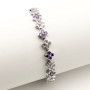 Zoppi Jewels:Bracciale tennis con fiori in acciaio e zirconi bianchi e viola:23,00 €
