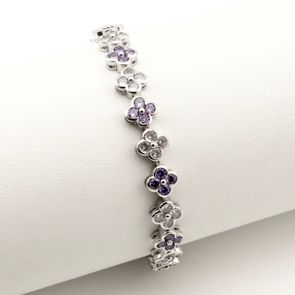 Zoppi Jewels:Bracciale tennis con fiori in acciaio e zirconi bianchi e viola:23,00 €